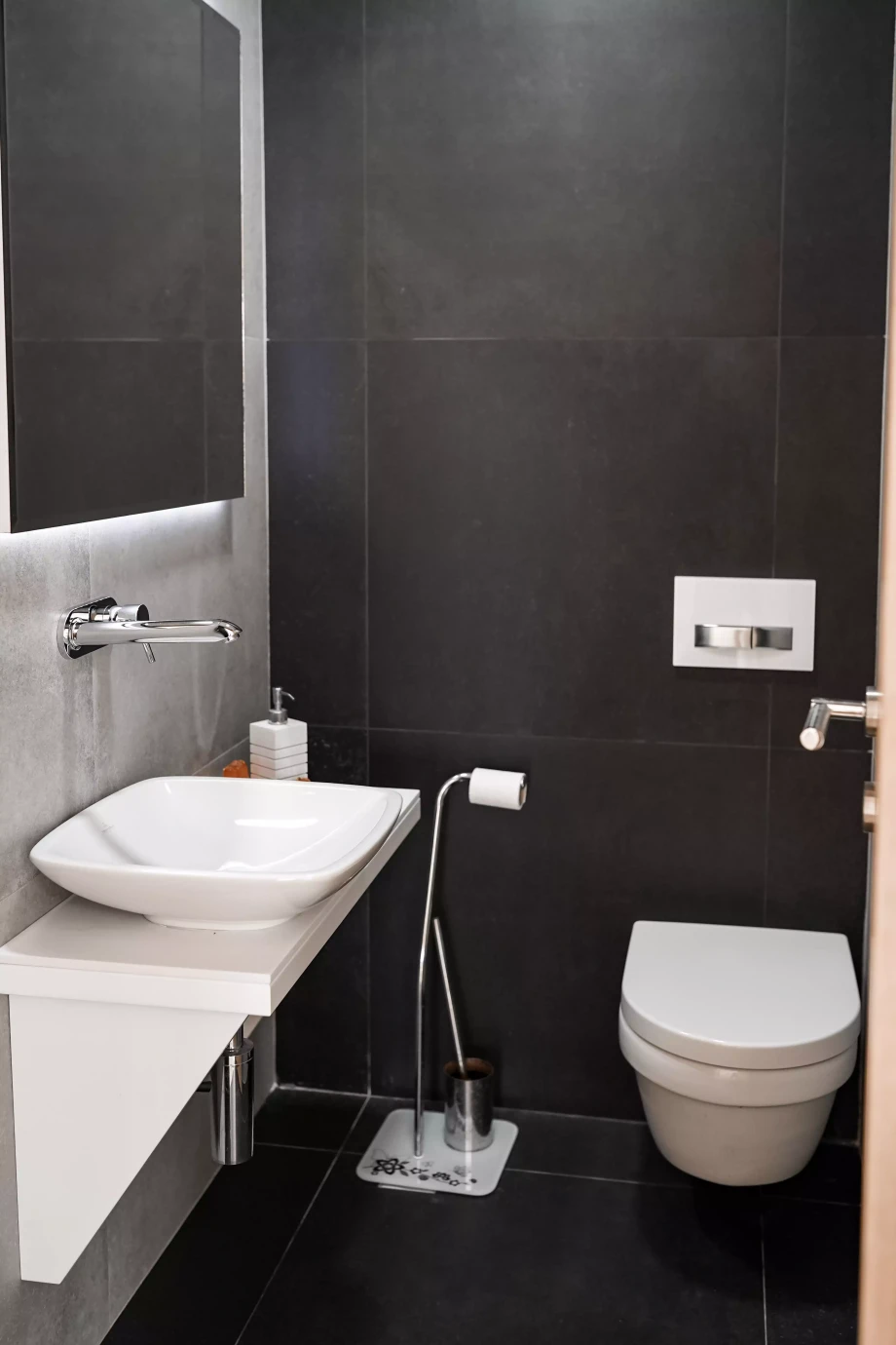 Elegant Bathroom with Dark Wall Palette in Villa