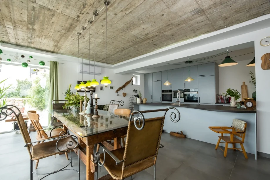 Wooden dining table with decorative chairs in a villa in Montenegro
