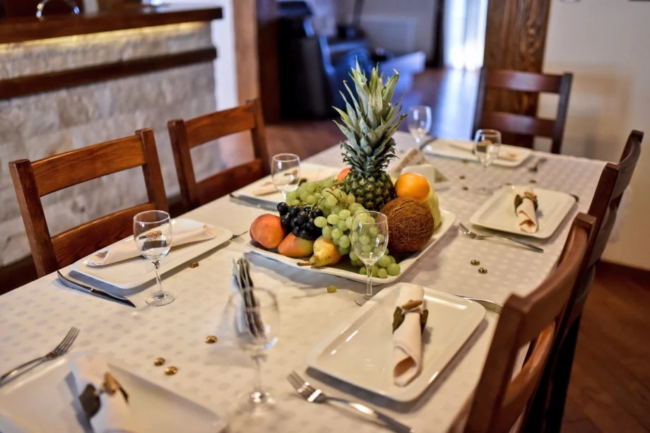 A prepared dining table with fruit