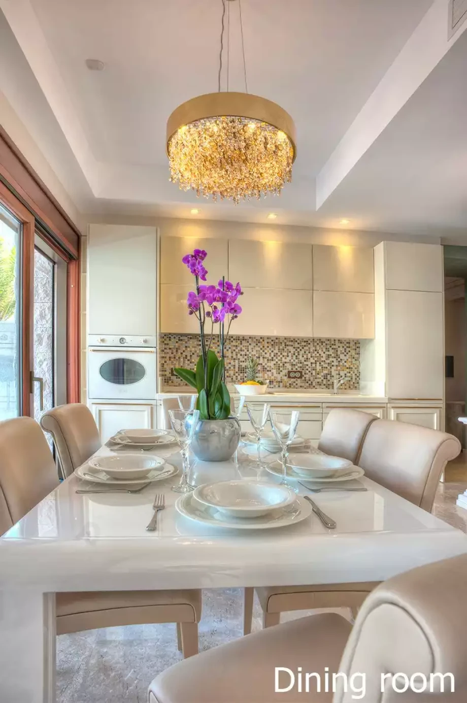 Elegant dining table with purple flowers in the villa's dining area