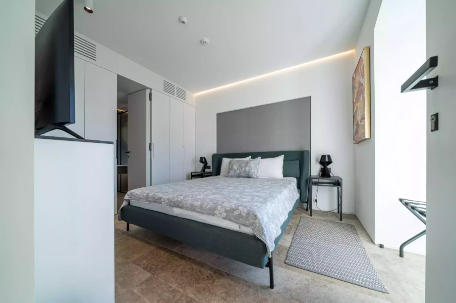 Contemporary Room for Two with Large Bed and TV