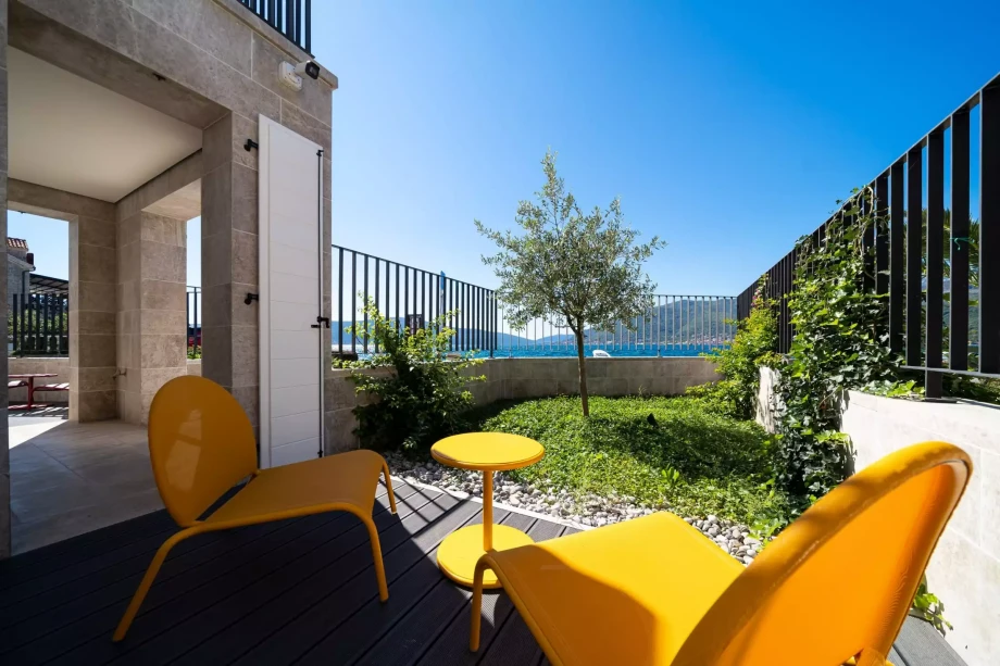 Yellow Chairs and a Table with Stunning Views in Villa
