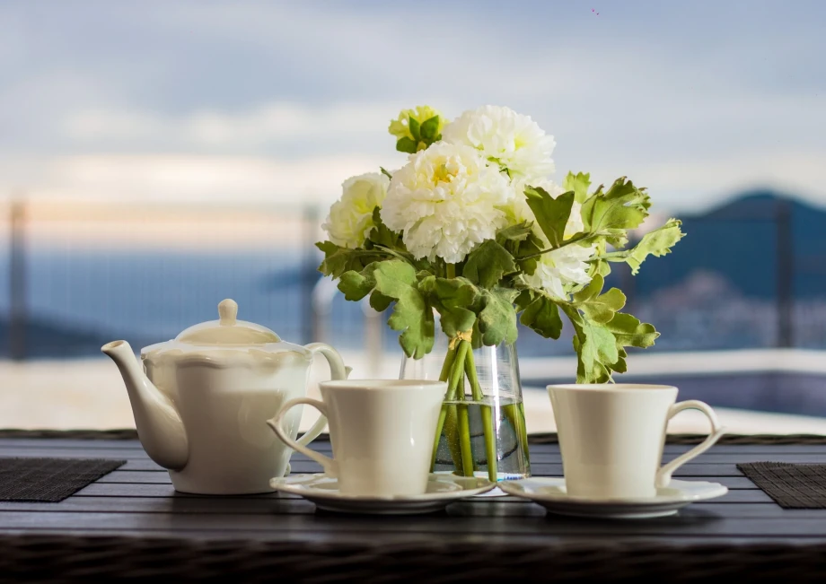 Tea table on an outdoor terrace overlooking Budva