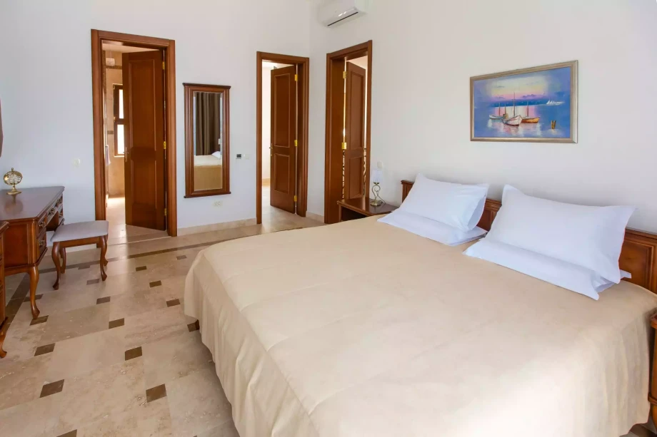 Elegant bedroom with beautiful furniture in villa for rent in Budva