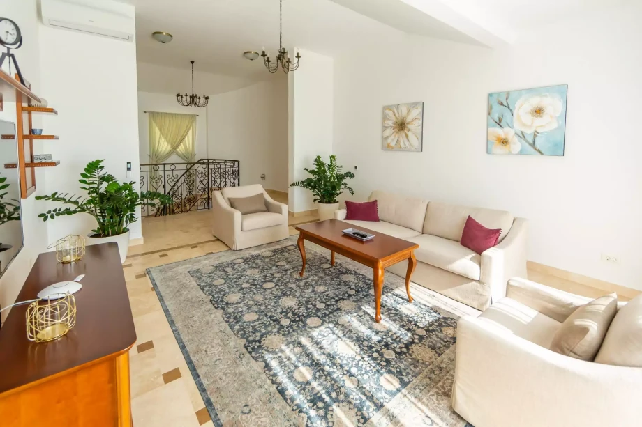 Lounge area with nice pearly-white furniture in an elegant villa for rent in Budva
