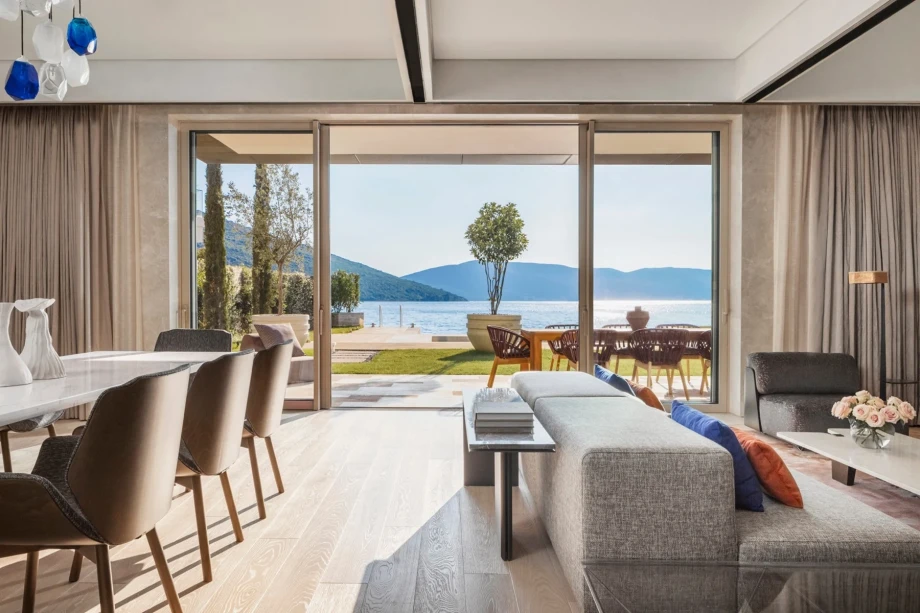 Luxurious living room with a panoramic sliding door and pool access,  One&Only Villa Orjen 3 Bedroom