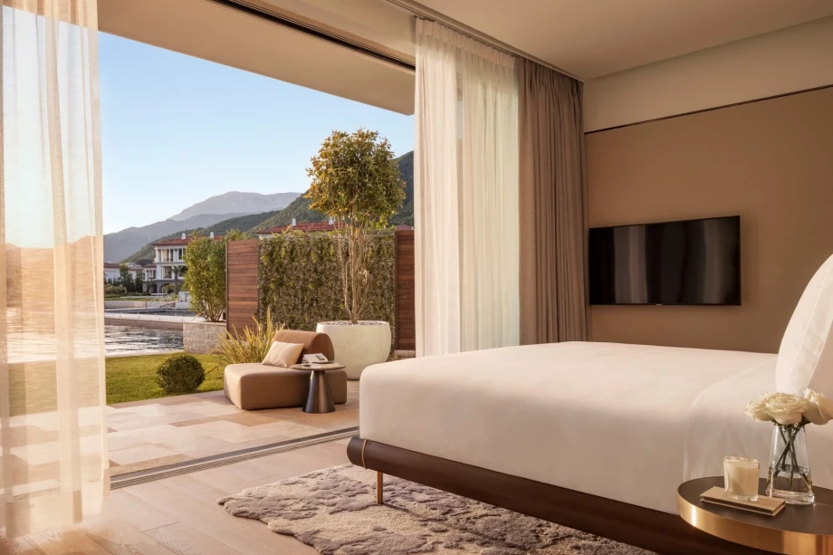 Spacious bedroom with a terrace and views of the villa swimming pool and Portonovi