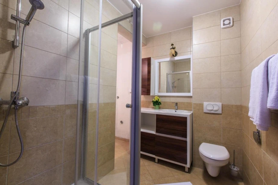 Spacious Bathroom with Shower and Sink Inside Villa in Budva, Montenegro