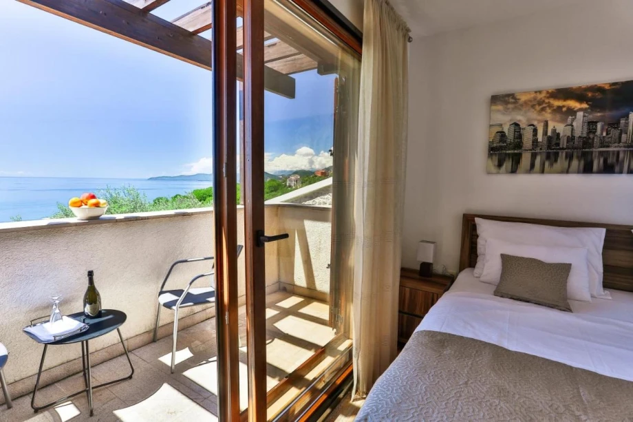 Bedroom with Terrace Access for Full Enjoyment at Villa for Rent in Budva
