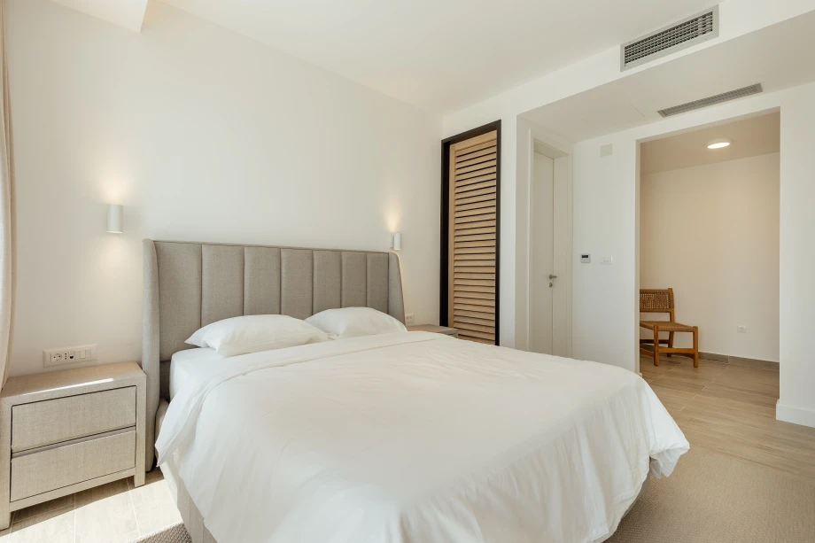 Cozy bedroom with a double bed in the villa