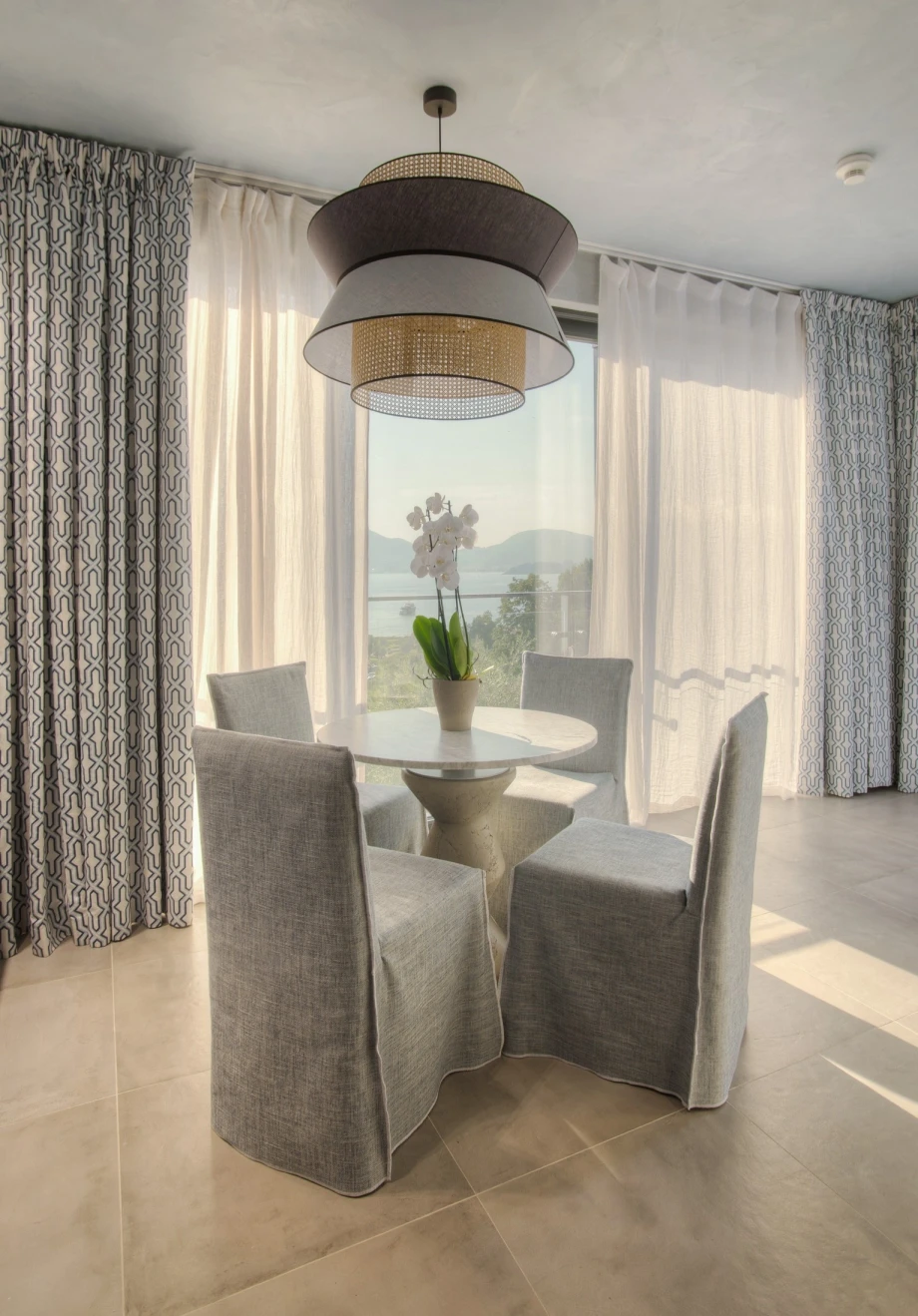 Elegant Outdoor Dining Setup with Stylish Table and Chairs in a Villa