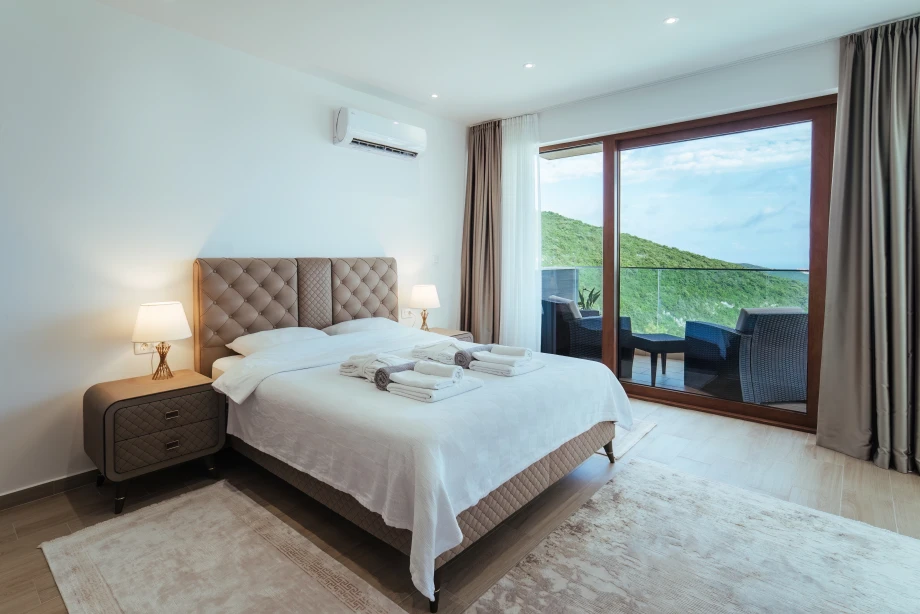 Elegant and Airy Bedroom with Ample Space for Comfort