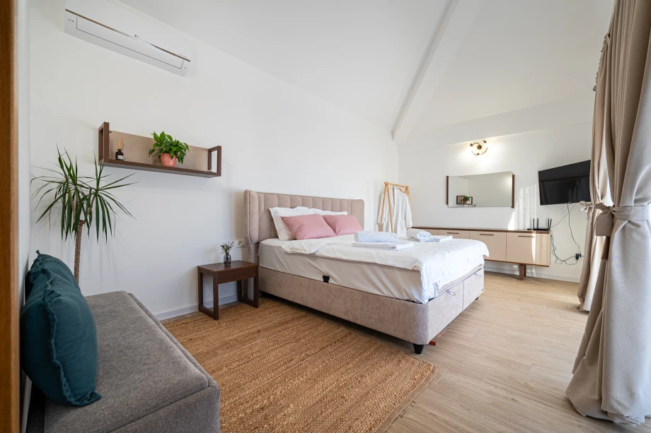 Lighted Bedroom with Serene Atmosphere – A Bright and Restful Space at the Villa