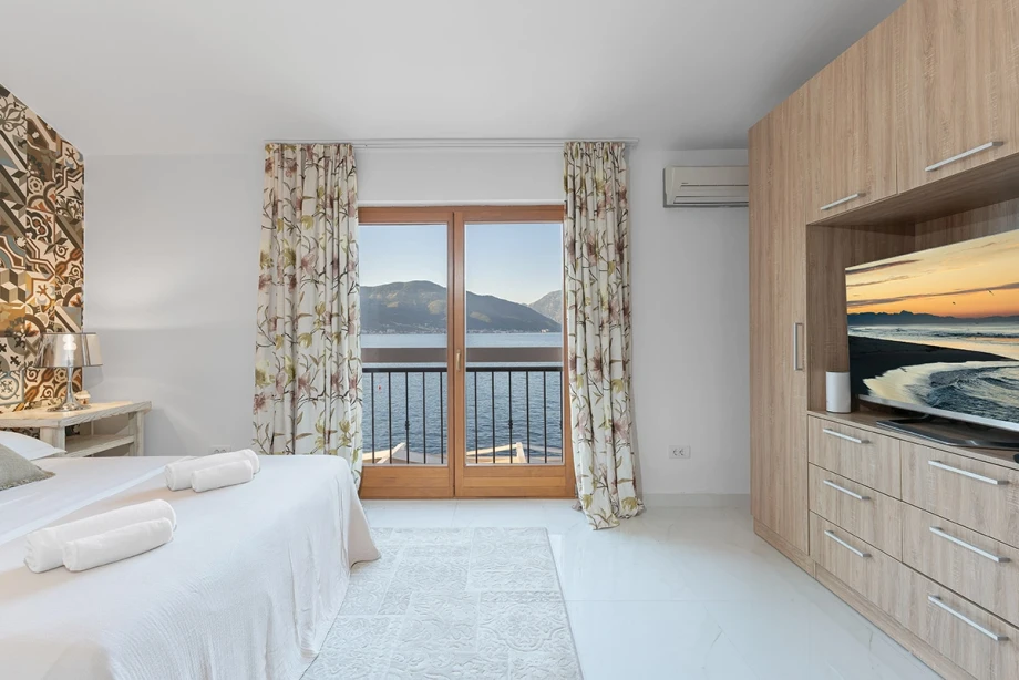 Spacious and Elegant Bedroom with Inviting Ambience at Montenegro Villa