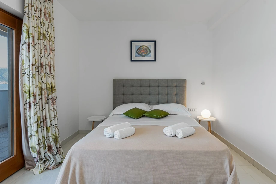 Cozy Bedroom with a Comfortable Bed for a Restful Stay at Montenegro Villa