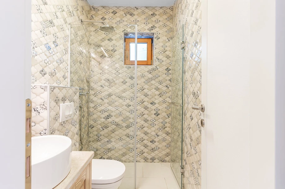 Elegant Spacious Bathroom with Modern Fixtures at Montenegro Villa