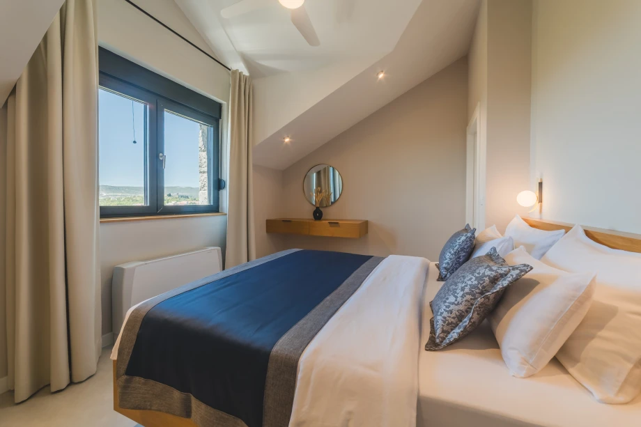 Spacious Villa Bedroom with Minimalist Design and Ample Natural Light