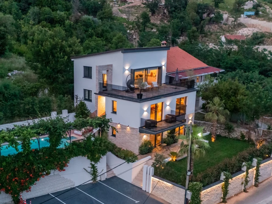 Front view of a big villa with expansive terraces and pool in Montenegro