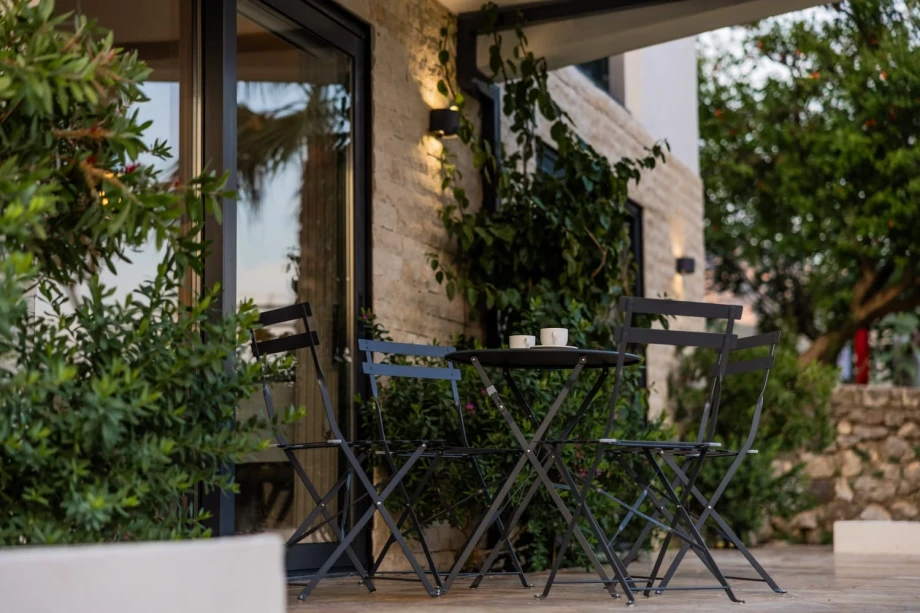 Outdoor table and chairs set in the yard of a Montenegro villa