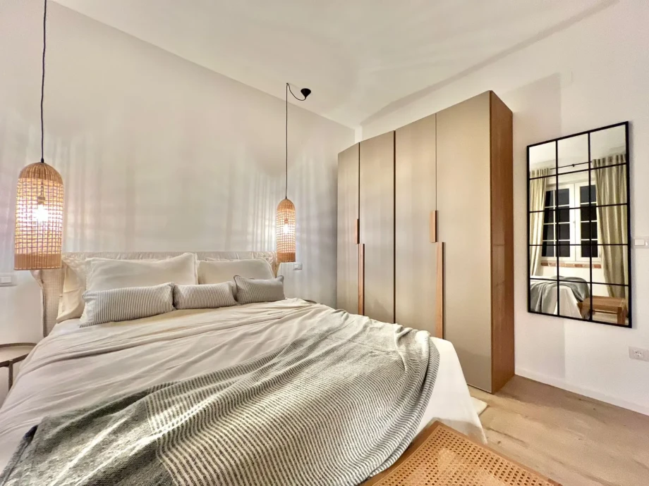 Spacious villa bedroom with comfortable bed