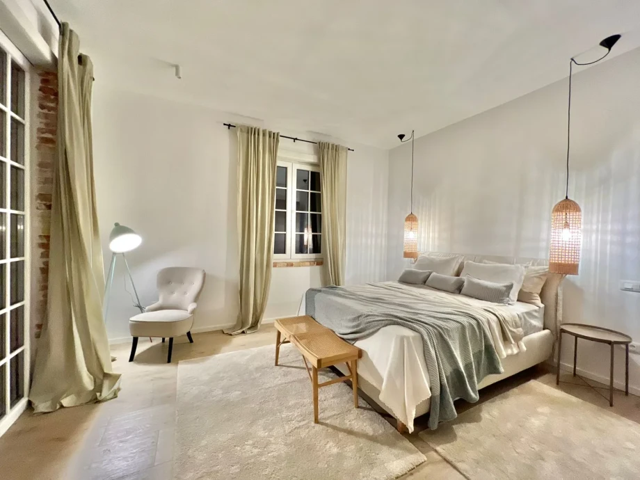 Villa bedroom interior with cozy bedding