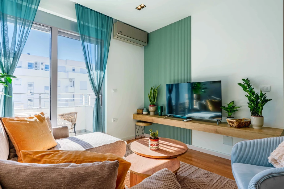 Spacious Open-Concept Living Room with TV at Azure Echo Retreat